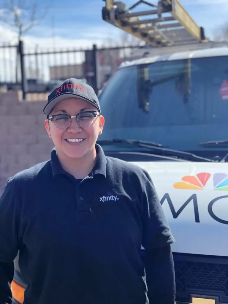 Diana Olivas stands in front of her van.