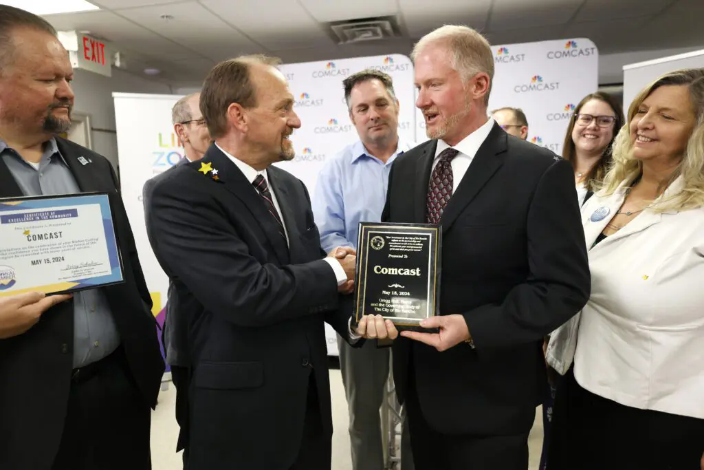 Attendees at a ribbon cutting event and celebration of Comcast’s expansion to Rio Rancho, NM.