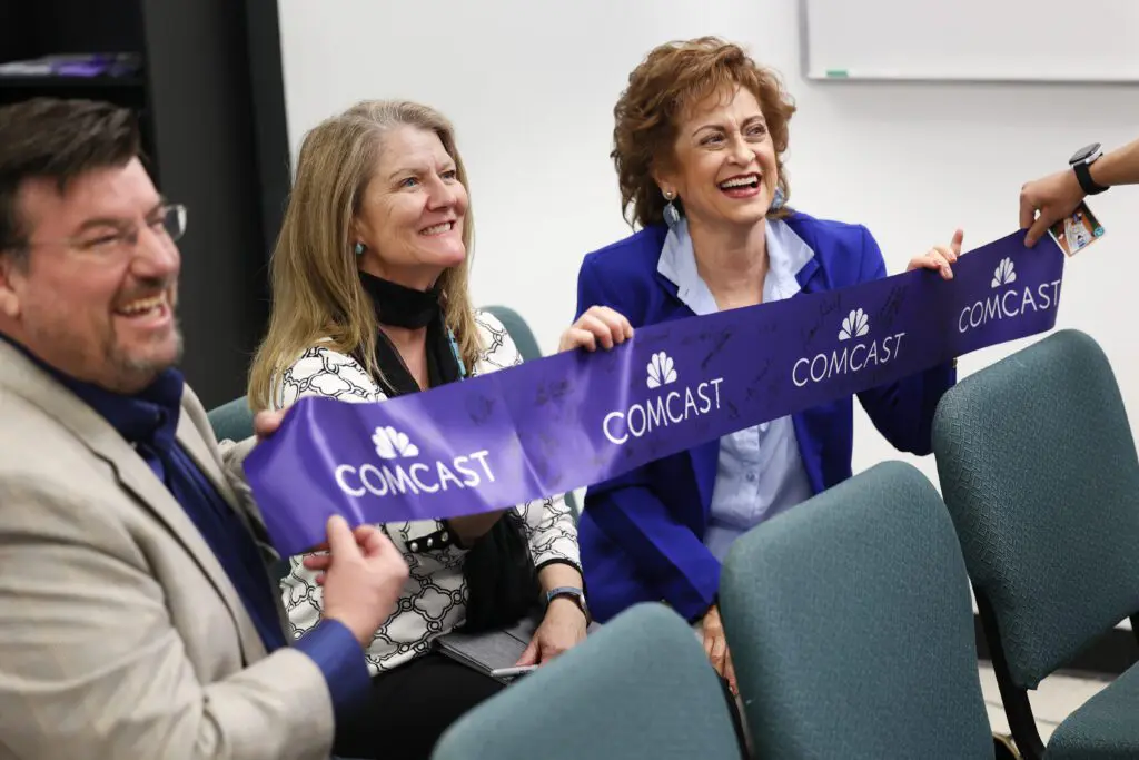 Attendees at a ribbon cutting event and celebration of Comcast’s expansion to Rio Rancho, NM.