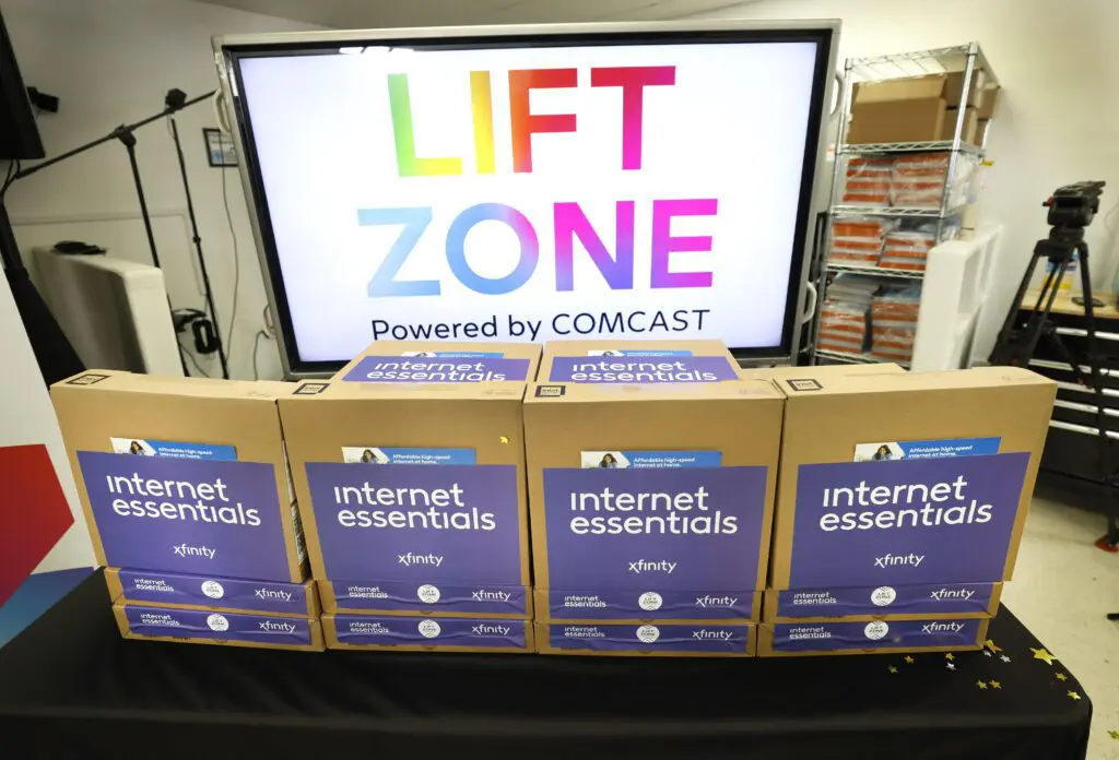 Laptops stacked up at a ribbon cutting event and celebration of Comcast’s expansion to Rio Rancho, NM.