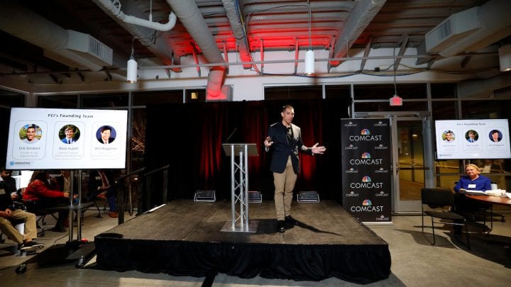 Erik Strobert, Chemical Engineering, UNM, Perspective Components Inc. onstage at the Pitch Deck Competition.