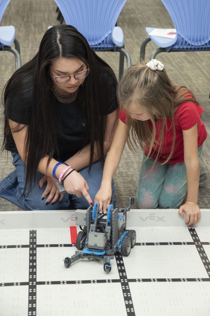 R4Creating staff member, Stevie Rae, is working with younger students in the STEAM Center of Excellence.